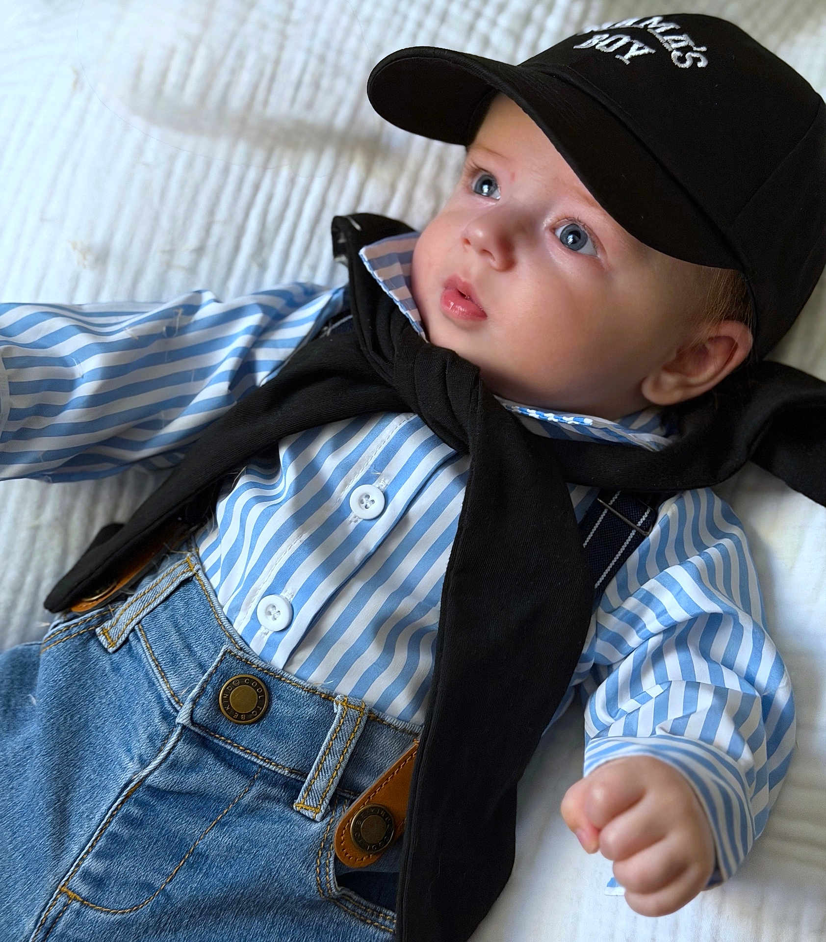 Brays joined the competition — help win amazing prizes! baby, child, blue_eyes, striped_shirt, denim_overalls, black_cap, black_sweater, infant, cute, portrait, lying_down, clothing, buttoned_shirt, fashion, face, hand, white_background, casual, young_child, hat