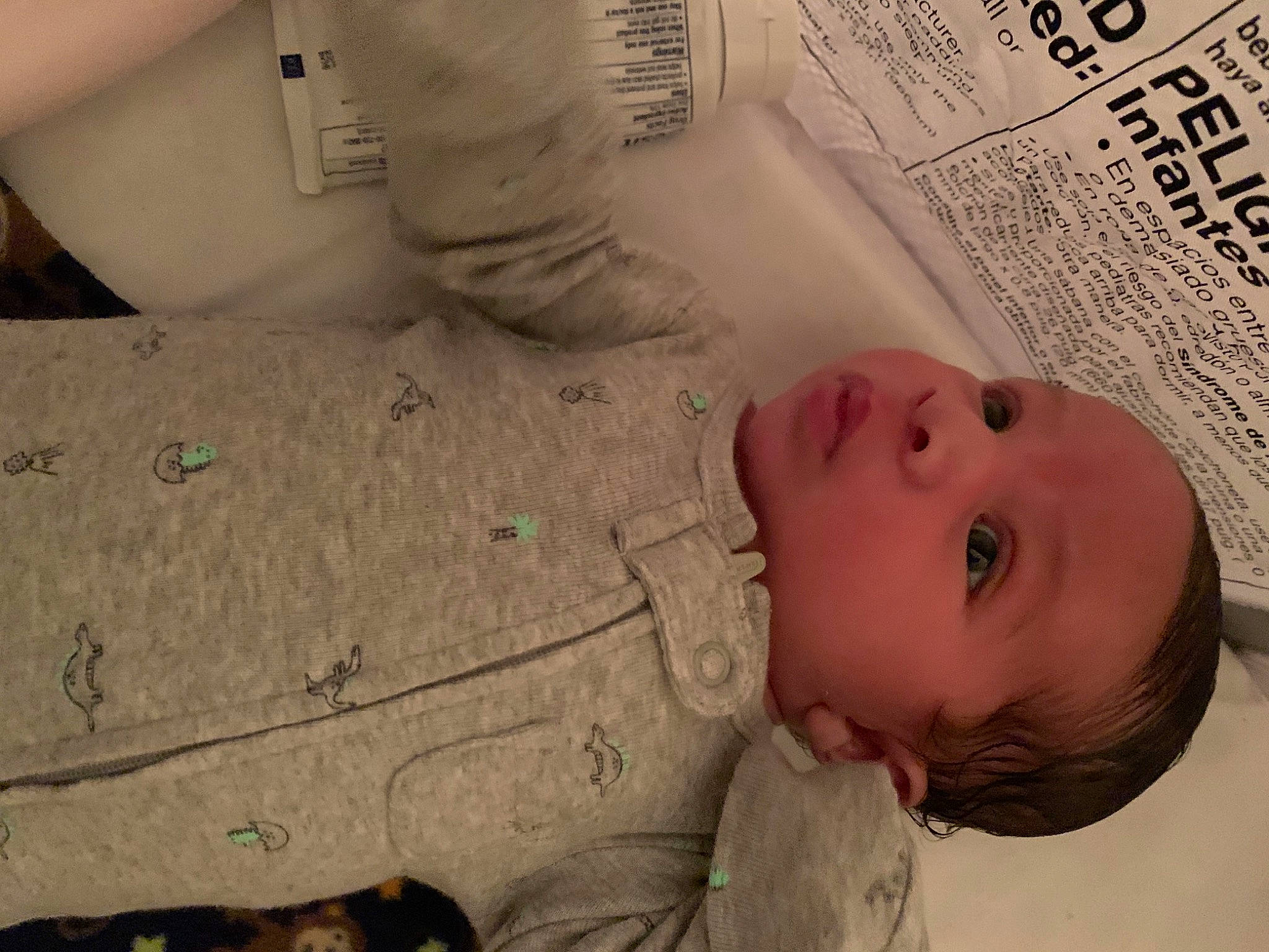 Jermaine is registered to the contest to win money with this photo: baby, baby_toddler_clothing, bedtime, cheek, child, comfort, font, illustration, linens, mouth, nose, pattern, person, room, skin, sleeve, textile, toddler, white, wood