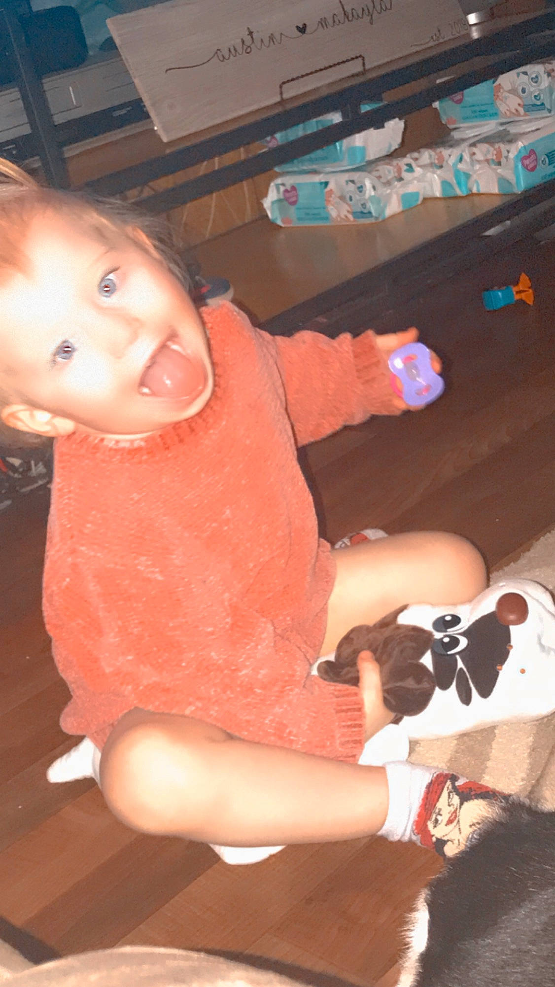 Adalynn joined the competition — help win amazing prizes! baby_toddler_clothing, black, child, companion_dog, facial_expression, finger, flooring, fun, hairstyle, human, human_leg, lap, mammal, mouth, person, sitting, skin, smile, thigh, thumb