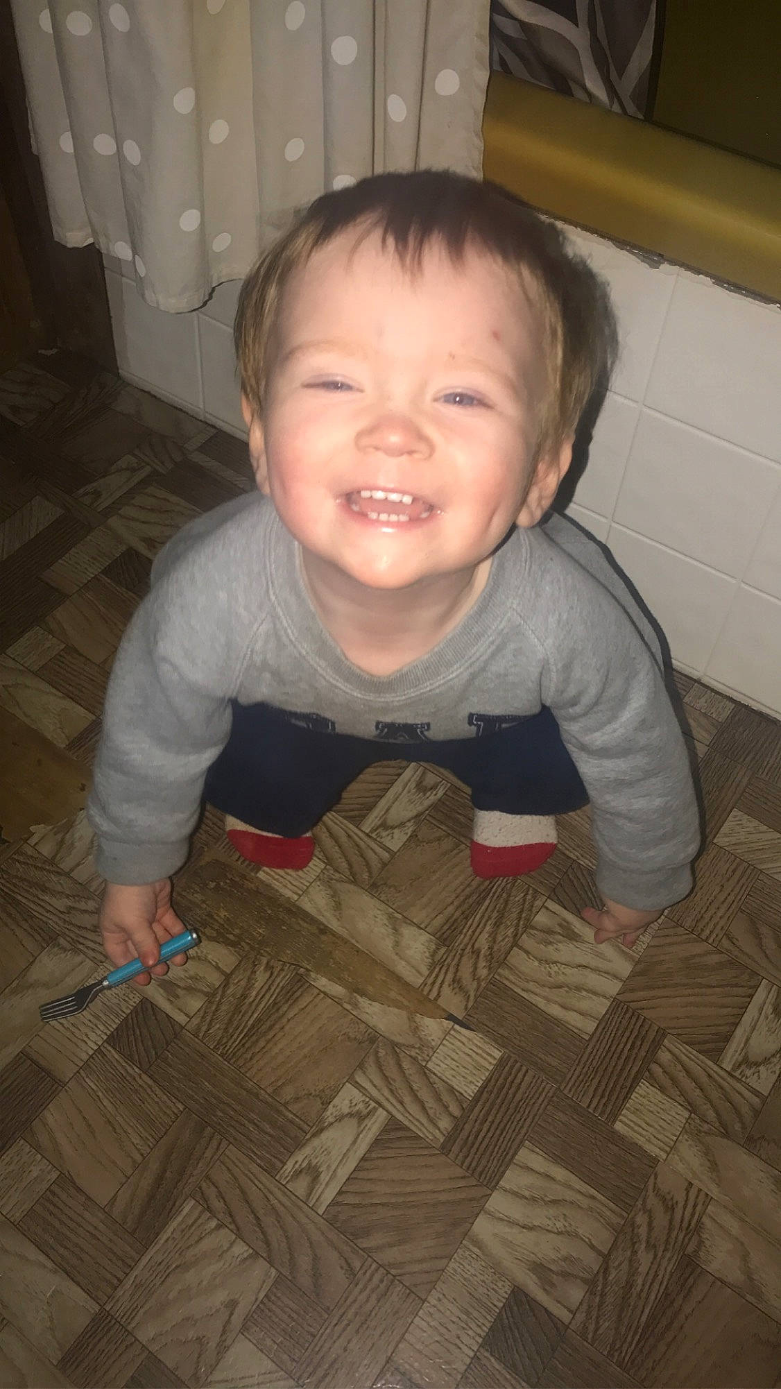 Corbyn is registered to the contest to win money with this photo: baby, baby_toddler_clothing, cheek, child, comfort, crawling, floor, flooring, fun, happy, hardwood, joy, nose, person, room, skin, sleeve, smile, thumb, toddler