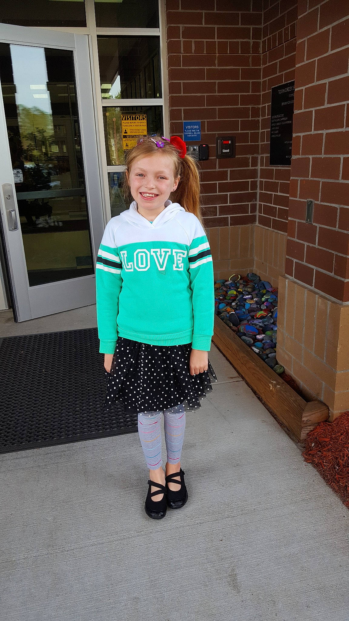 Cami is registered to the contest to win money with this photo: child, clothing, costume, design, joy, outerwear, pattern, person, shoe, sleeve, snapshot, standing, style, t_shirt, turquoise