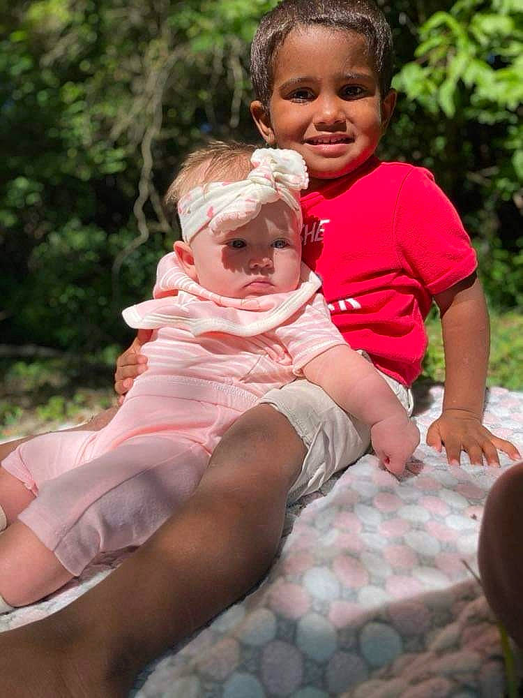 Nevaeh joined the competition — help win amazing prizes! baby_toddler_clothing, child, dress, face, facial_expression, fun, gesture, grass, happy, head, headwear, joy, leisure, people_in_nature, person, pink, plant, shorts, skin, smile