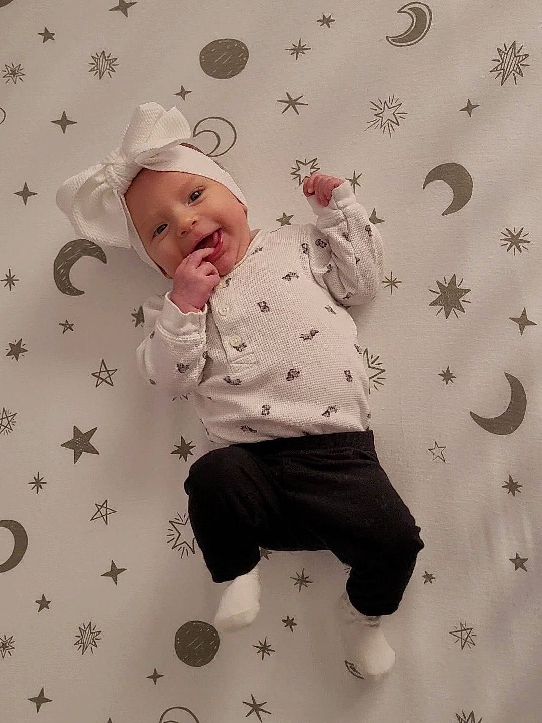 Celine is registered to the contest to win money with this photo: baby, baby_toddler_clothing, carmine, child, circle, design, fun, happy, headwear, pattern, people_in_nature, person, sleeve, toddler, white