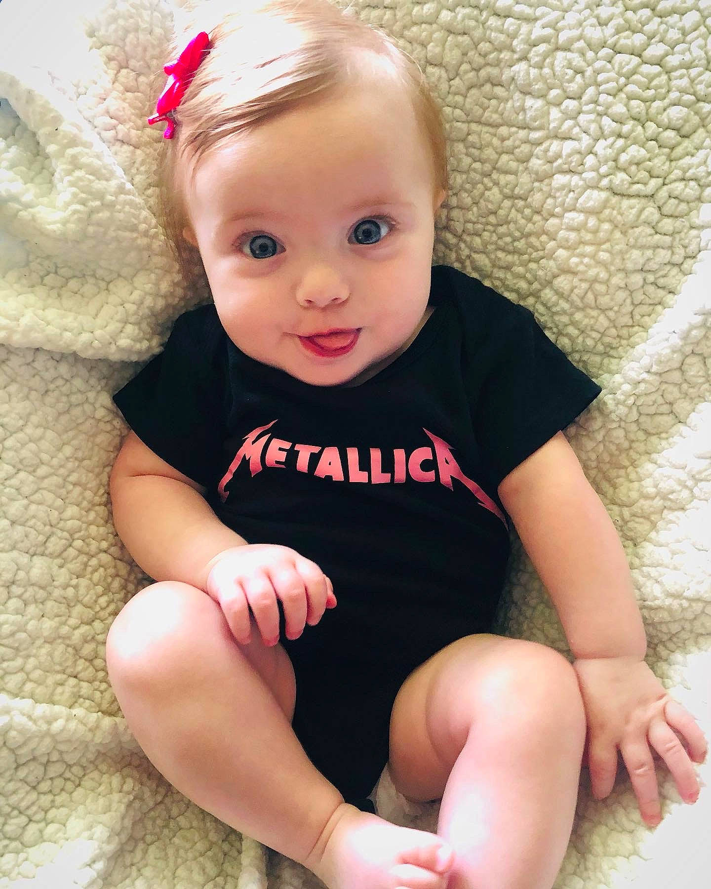 Sage is registered to the contest to win money with this photo: baby_toddler_clothing, cheek, chin, eye, face, finger, hair, head, human_body, iris, knee, leg, lip, neck, person, pink, shoulder, skin, sleeve, smile