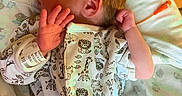 Julian joined the competition — help win amazing prizes! newborn, baby, sleeping, infant, hospital, bracelet, onesie, animal_print, blanket, pillow, bed, peaceful, cute, child, person, indoors, rest, face, hand, skin