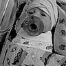 Julian is registered to the contest to win money with this photo: newborn, baby, blanket, pacifier, hospital, crib, swaddled, hat, infant, sleeping, monochrome, bed, soft, cozy, cute, pattern, fabric, person, rest, healthcare