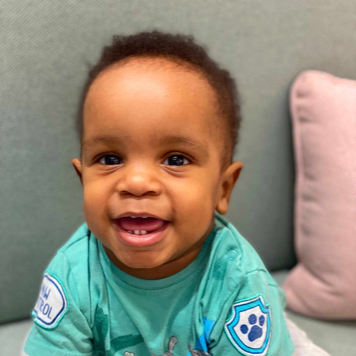 Quincy is registered to the contest to win money with this photo: baby, child, clothing, couch, crawling, cute, expression, eyes, face, happy, head, indoor, mouth, patch, person, pillow, shirt, skin, smiling, toddler