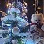 puppy, dog, christmas_tree, ornaments, lights, holiday, decorations, fluffy, white, festive, hands, winter, celebration, cute, indoors, pine_tree, garland, toy, christmas, cozy