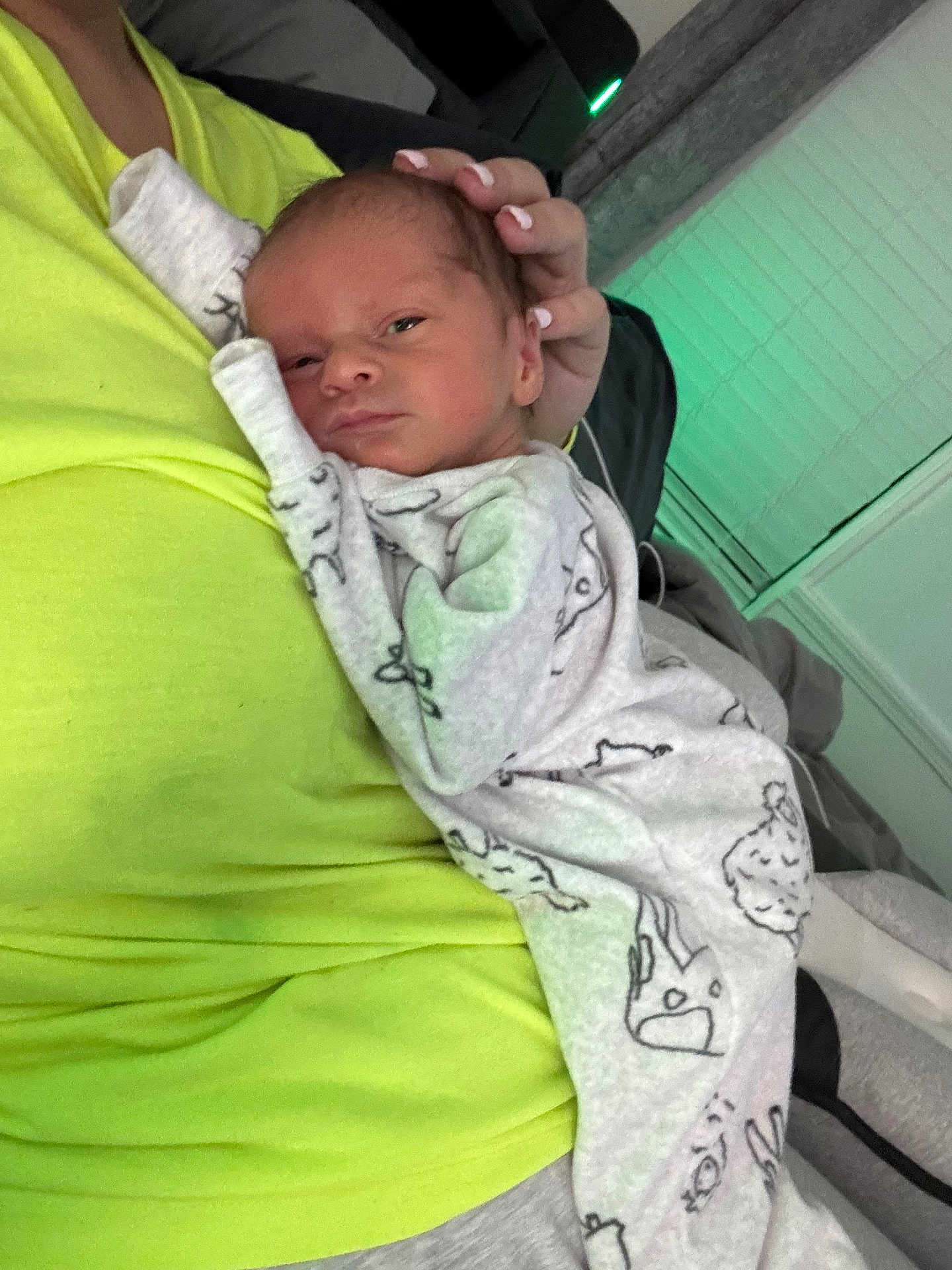 Brayden joined the competition — help win amazing prizes! newborn, baby, infant, person, hand, clothing, onesie, bed, blanket, indoor, resting, tender, care, human, sleepwear, closeup, comfort, soft, parent, holding