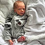 Brayden joined the competition — help win amazing prizes! newborn, baby, infant, onesie, grey_clothing, blanket, white_blanket, cozy, cute, foot, face, portrait, lying_down, soft_texture, sleepwear, small_hands, small_feet, indoors, resting, curious_expression