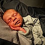 Brayden is registered to the contest to win money with this photo: baby, newborn, sleeping, infant, pillow, blanket, soft, cozy, hand, face, clothing, bed, closeup, peaceful, resting, indoors, portrait, warm_light, skin, toddler
