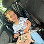 Ambre participe au concours pour gagner de l'argent avec cette photo : blue_pants, bunny, car_interior, car_seat, casual_clothing, child, daytime, happy, plush_toy, safety, seat, seatbelt, sitting, smiling, striped_shirt, toy, travel, window, yellow_headband, young_girl