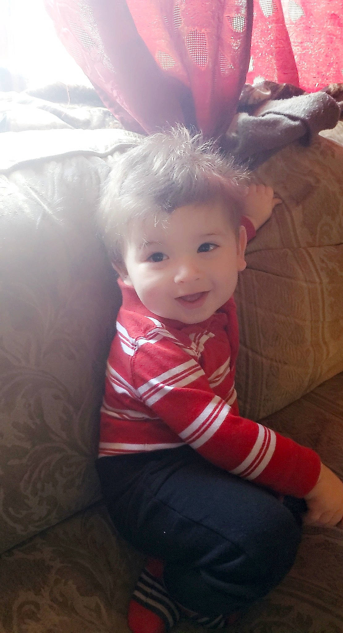 Dustin Jr. is registered to the contest to win money with this photo: baby, baby_toddler_clothing, child, comfort, costume_hat, eye, fashion_accessory, flash_photography, flooring, fun, happy, head, headpiece, human_leg, leg, magenta, person, pink, sitting, smile