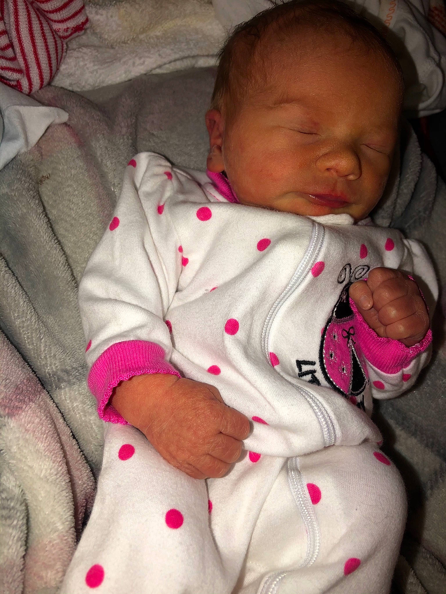 Lindsey joined the competition — help win amazing prizes! arm, baby, baby_sleeping, baby_toddler_clothing, cheek, child, comfort, facial_expression, finger, linens, lip, mouth, nose, person, pink, sitting, skin, sleeve, textile, toddler