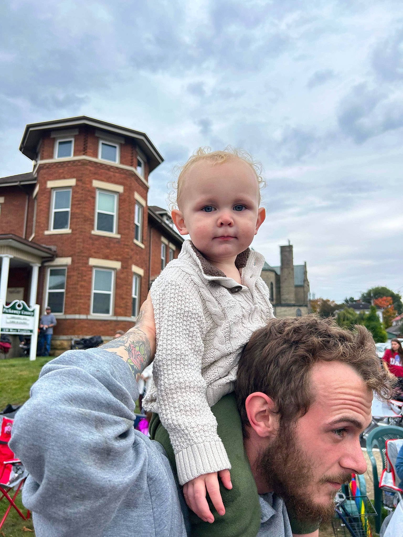 Tristan is registered to the contest to win money with this photo: baby, beard, blurred, building, child, city, cloud, event, face, fun, gesture, grass, happy, leisure, person, plant, recreation, sky, toddler, travel