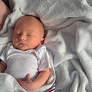 Cayson is registered to the contest to win money with this photo: baby, newborn, sleeping, blanket, white_clothing, soft_texture, peaceful, infant, wrapped, closeup, human, skin, hand, cozy, comfort, cute, portrait, resting, indoors, warm