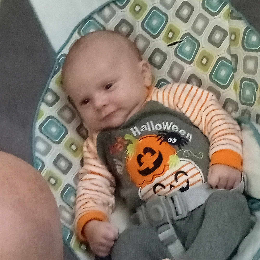 Brayden is registered to the contest to win money with this photo: baby, bed, blanket, bodypart, clothing, crib, cushion, face, finger, furniture, hand, hat, head, homedecor, infantbed, newborn, person, photography, portrait, sleeping