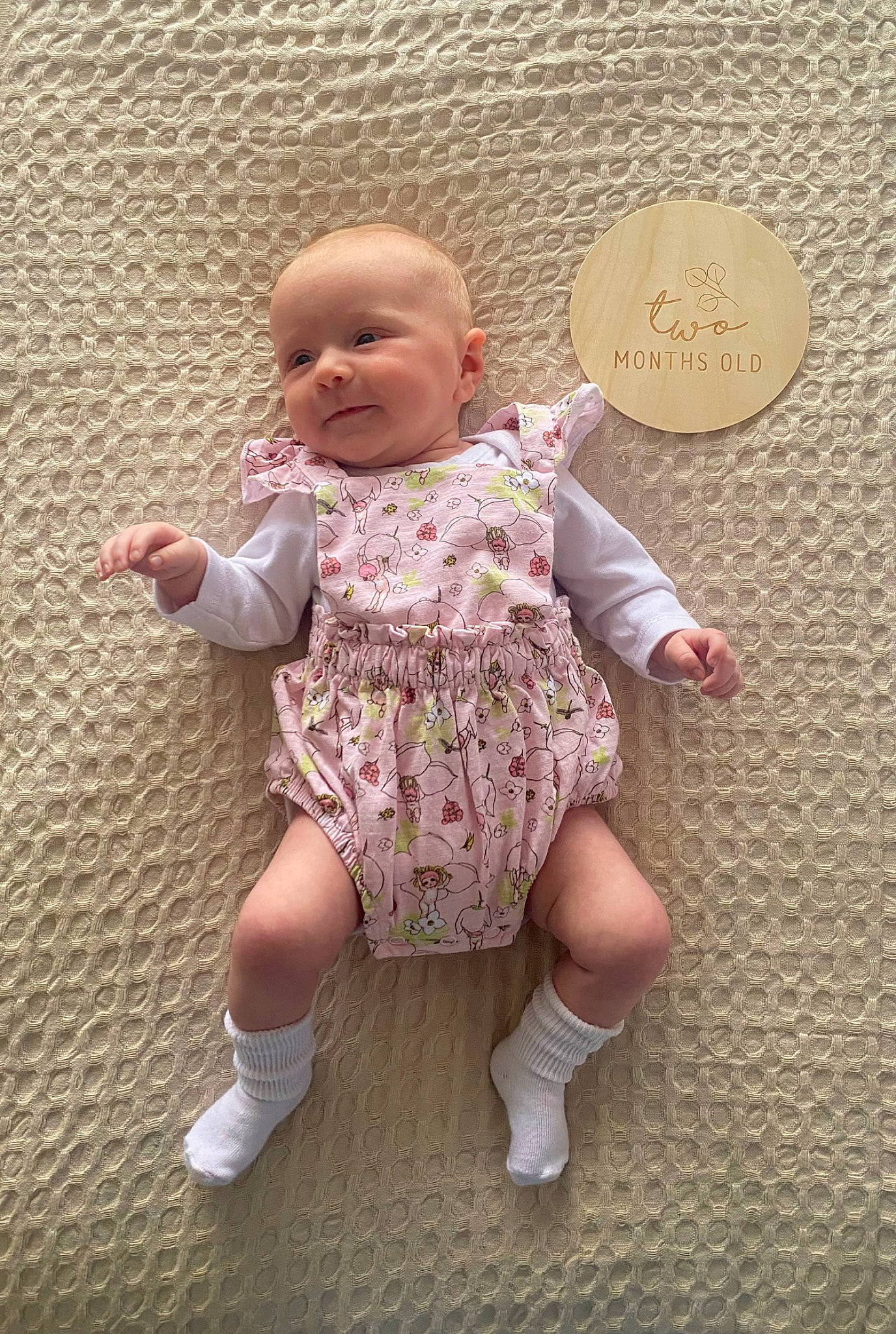 Brynli joined the competition — help win amazing prizes! baby, baby_toddler_clothing, cheek, child, circle, day_dress, dress, flooring, foot, happy, human_leg, magenta, pattern, person, pink, sitting, skin, sleeve, sock, thumb