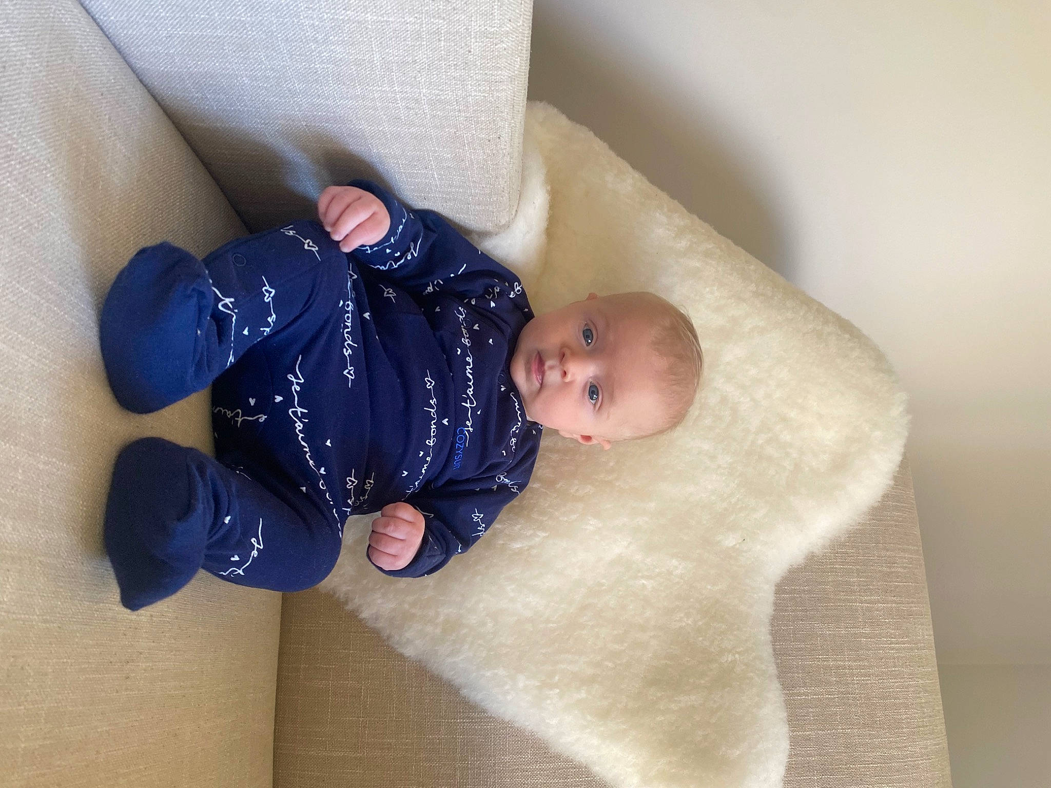 Brynli is registered to the contest to win money with this photo: baby, baby_products, baby_sleeping, baby_toddler_clothing, bedding, child, comfort, couch, flooring, foot, infant_bed, leg, linens, pattern, person, room, sitting, sleeve, sock, toddler