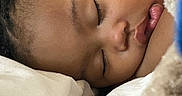 Khalyla is registered to the contest to win money with this photo: blanket, calm, child, close_up, comfort, cozy, eyelashes, face, indoors, lips, nap, peaceful, portrait, relaxation, rest, skin, sleeping, soft, toddler, young