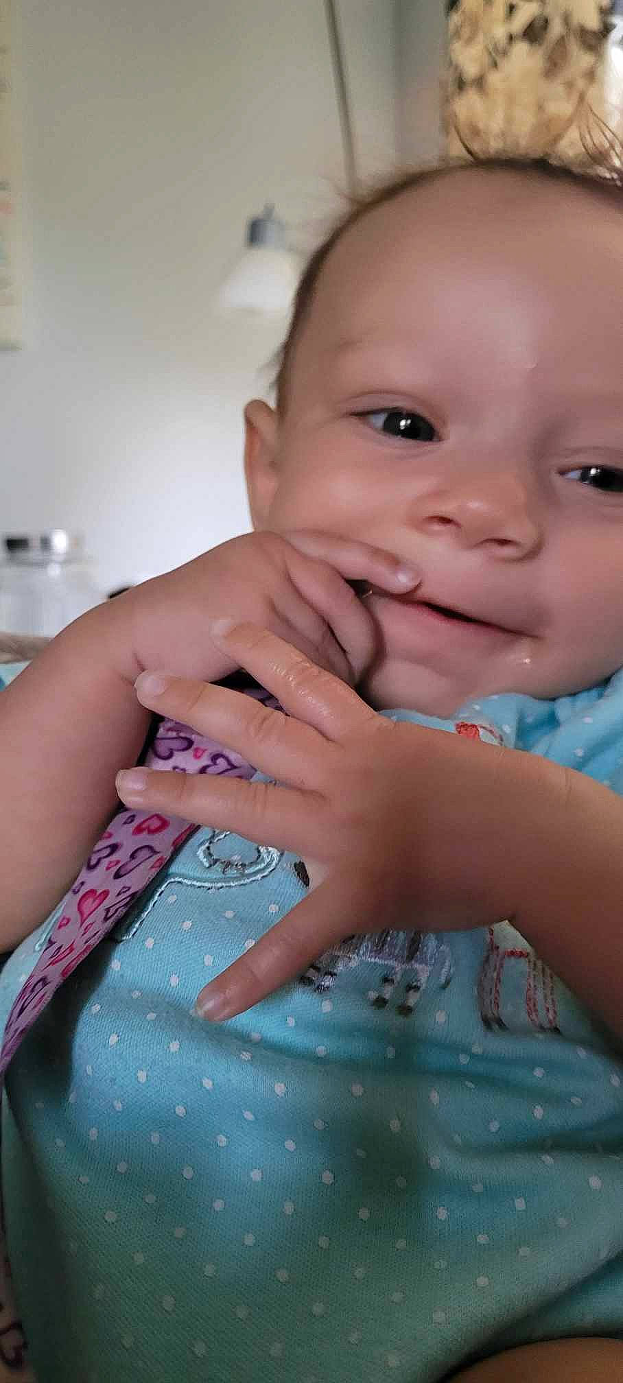 Raylyn is registered to the contest to win money with this photo: baby, baby_toddler_clothing, cheek, drinkware, eyelash, facial_expression, finger, fun, gesture, hand, happy, lip, mouth, nail, nose, person, pink, skin, smile, thumb