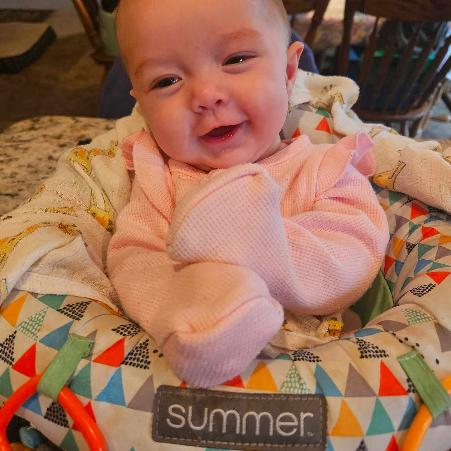 Ainsley is registered to the contest to win money with this photo: architecture, baby, building, chair, cushion, diningtable, face, furniture, happy, head, homedecor, indoors, newborn, person, photography, portrait, quilt, sitting, smile, table