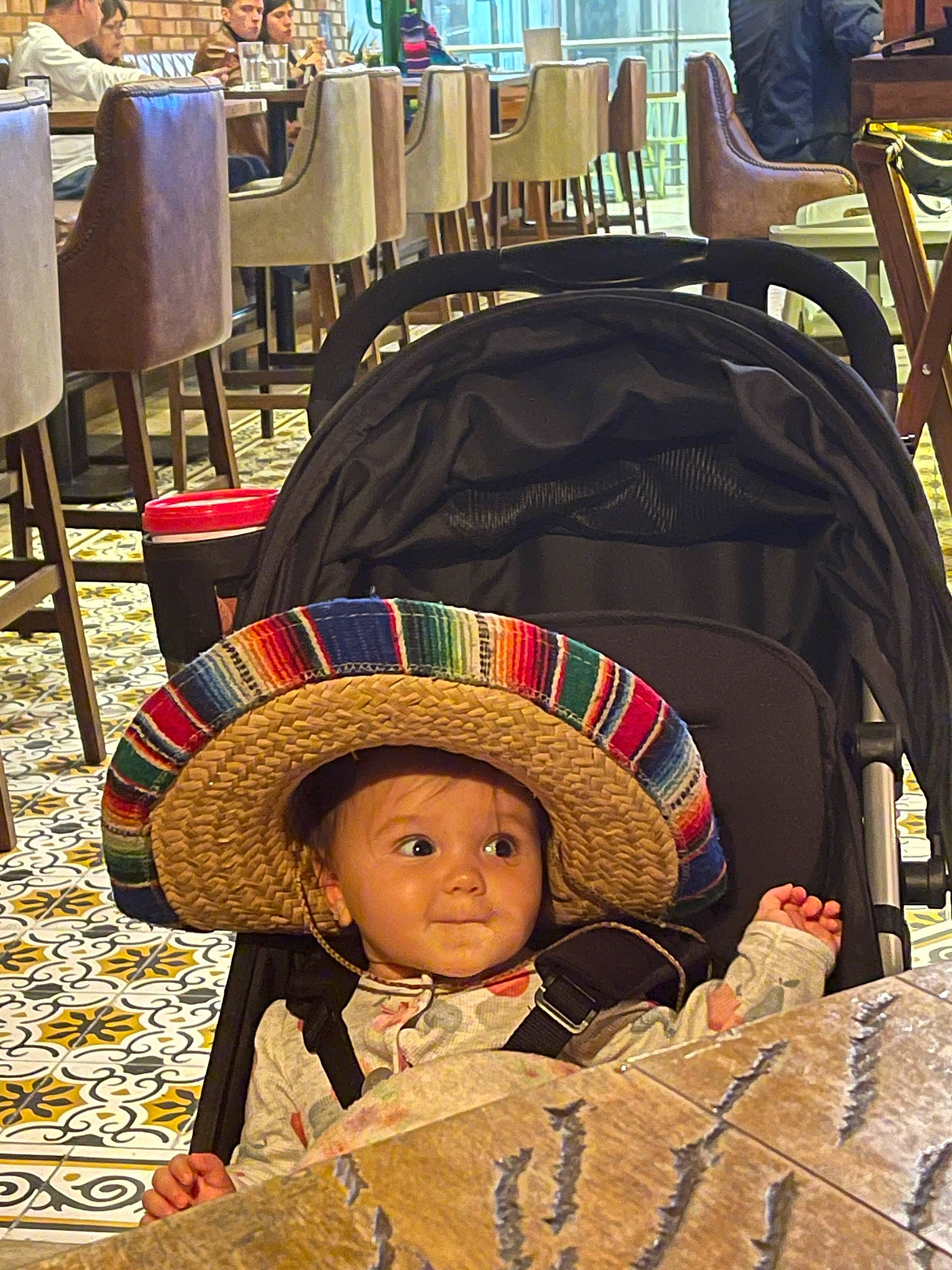Kaylee joined the competition — help win amazing prizes! carpet, chair, child, city, costume_hat, event, fashion_accessory, flooring, fun, hat, headgear, headwear, human_settlement, leisure, person, product, sun_hat, t_shirt, toddler, tradition
