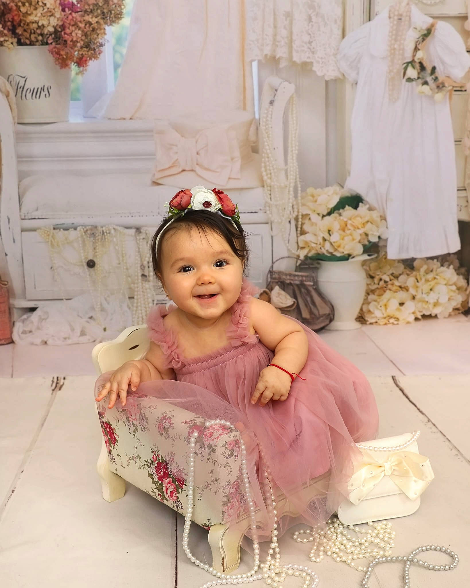 Kaylee is registered to the contest to win money with this photo: baby, baby_toddler_clothing, child, dress, embellishment, event, fashion, flower, flower_arranging, happy, hat, joy, people, person, pink, plant, product, smile, textile, toddler