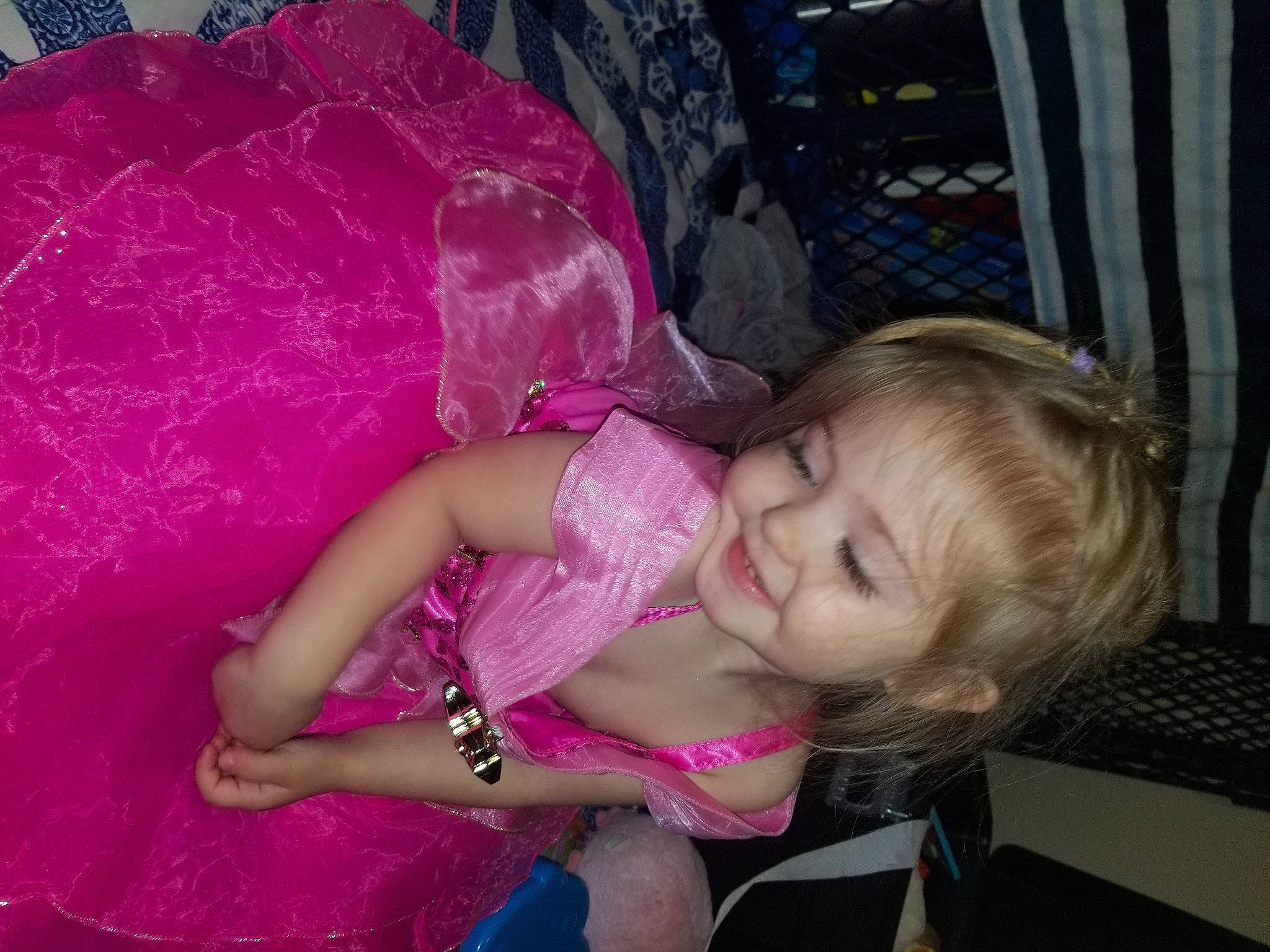 Aaliyah is registered to the contest to win money with this photo: baby, baby_toddler_clothing, child, comfort, embellishment, fashion_accessory, fun, magenta, pattern, person, pink, purple, smile, toddler