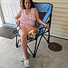Champ is registered to the contest to win money with this photo: blue_chair, casual_portrait, chair, companion, concrete, dog, door, home, manhole_cover, outdoor, person, pet, phone, pink_outfit, porch, seated, siding, slippers, small_dog, woman