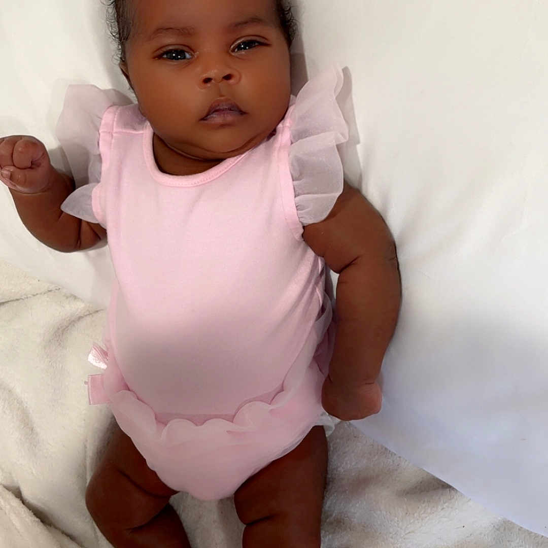 Eislyn joined the competition — help win amazing prizes! adorable, baby, baby_girl, blanket, child, cute, indoors, infant, lying_down, newborn, one_person, peaceful, pink_clothing, portrait, resting, skin, sleepwear, small_hands, sock, soft_texture