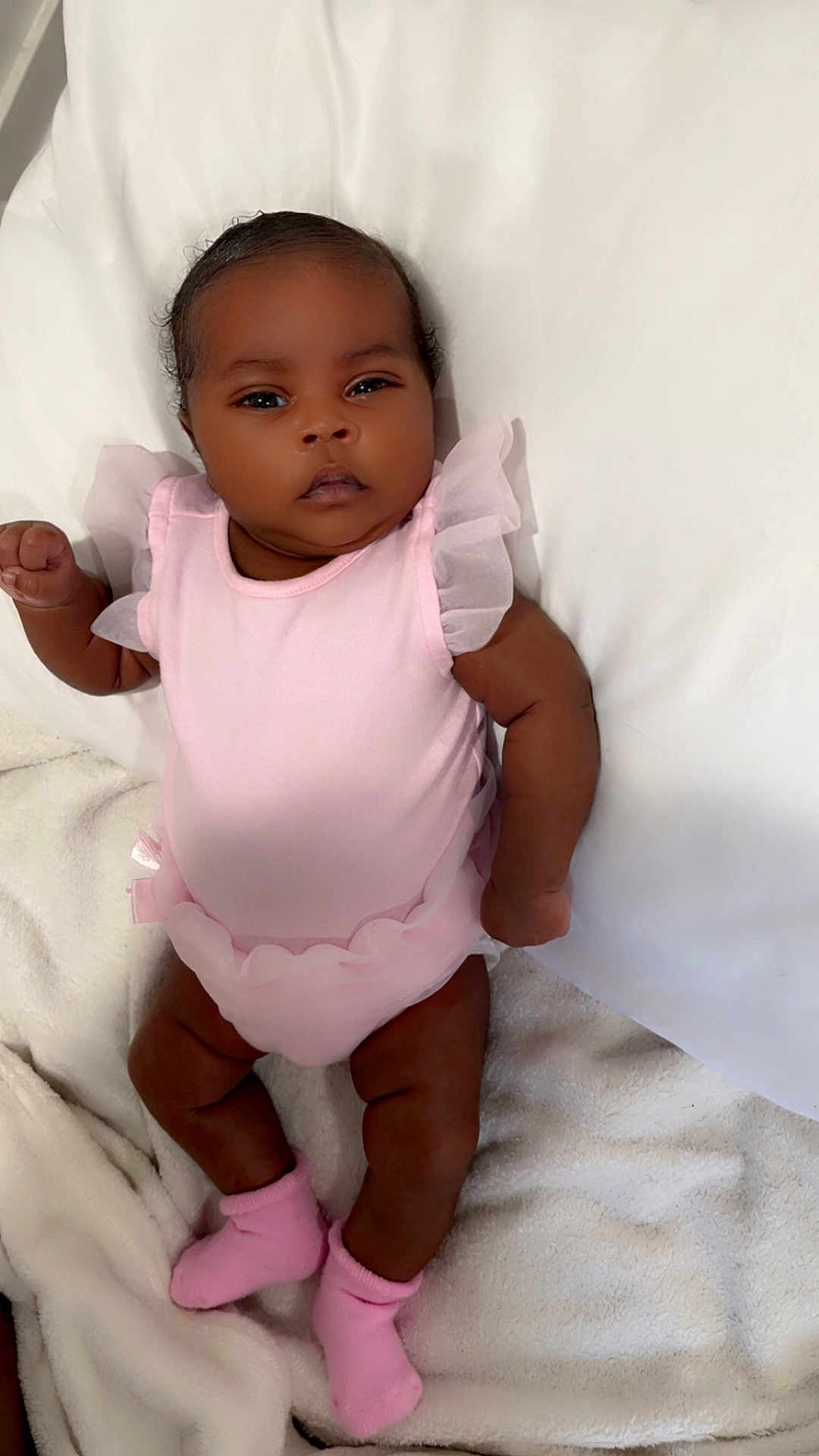 Eislyn joined the competition — help win amazing prizes! adorable, baby, baby_girl, blanket, child, cute, indoors, infant, lying_down, newborn, one_person, peaceful, pink_clothing, portrait, resting, skin, sleepwear, small_hands, sock, soft_texture