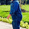 Shivaan is registered to the contest to win money with this photo: casual_clothing, child, daytime, denim, fence, grass, greenery, happy, jumpsuit, nature, outdoor, pavement, person, playful, side_view, smile, sneakers, sunlight, toddler, young_child