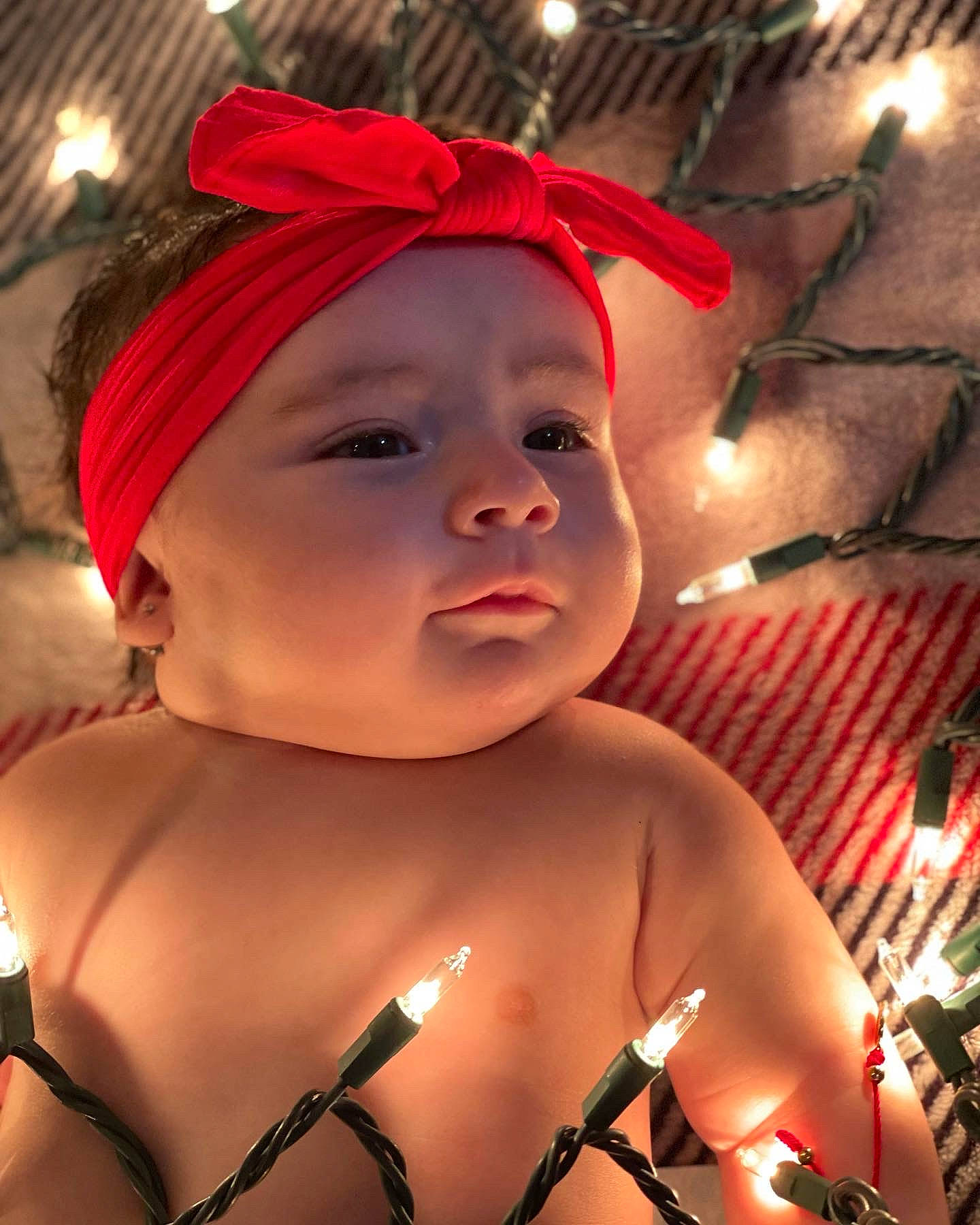 Khalani is registered to the contest to win money with this photo: arm, baby, chest, eye, finger, flash_photography, hand, happy, hat, headgear, headwear, leisure, lip, mouth, muscle, neck, person, pink, skin, smile