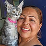 Camila joined the competition — help win amazing prizes! woman, cat, kitten, pet, smile, earrings, pink_collar, furry, portrait, indoor, face, happy, animal, domestic_animal, person, closeup, holding, cute, friendly, feline