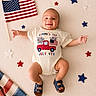american_flag, baby, blanket, blue, celebration, child, flag, happy, holiday, infant, july_4th, onesie, patriotic, portrait, red, sandals, smiling, soft_surface, stars, white
