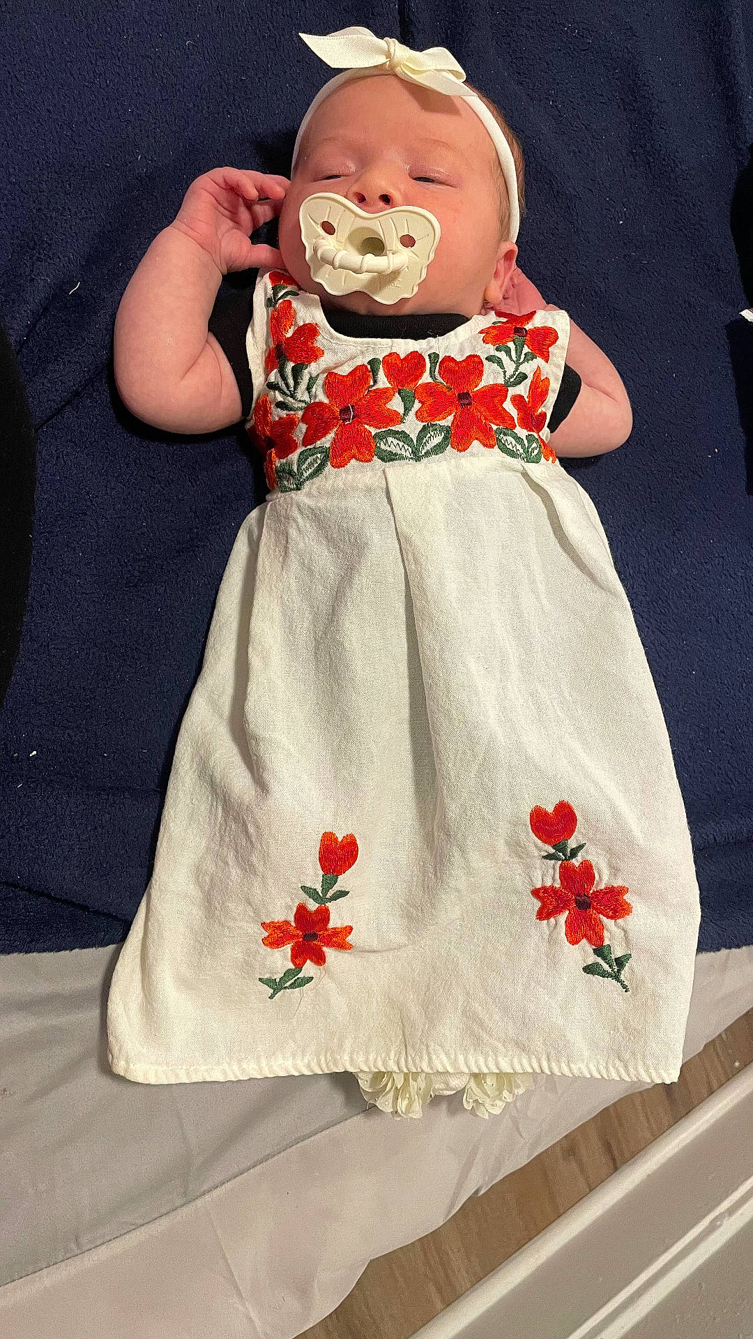 Leia joined the competition — help win amazing prizes! baby, blanket, child, clothing, comfort, cute, dress, embroidery, fabric, floral, headband, human, indoors, infant, lying_down, pacifier, person, rest, sleeping, soft