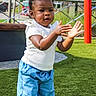 Rowyn joined the competition — help win amazing prizes! activity, blue_pants, casual_clothing, child, clapping, daylight, fun, grass, happy, nature, outdoor, park, person, play, playground, smile, summer, toddler, white_top, young_child