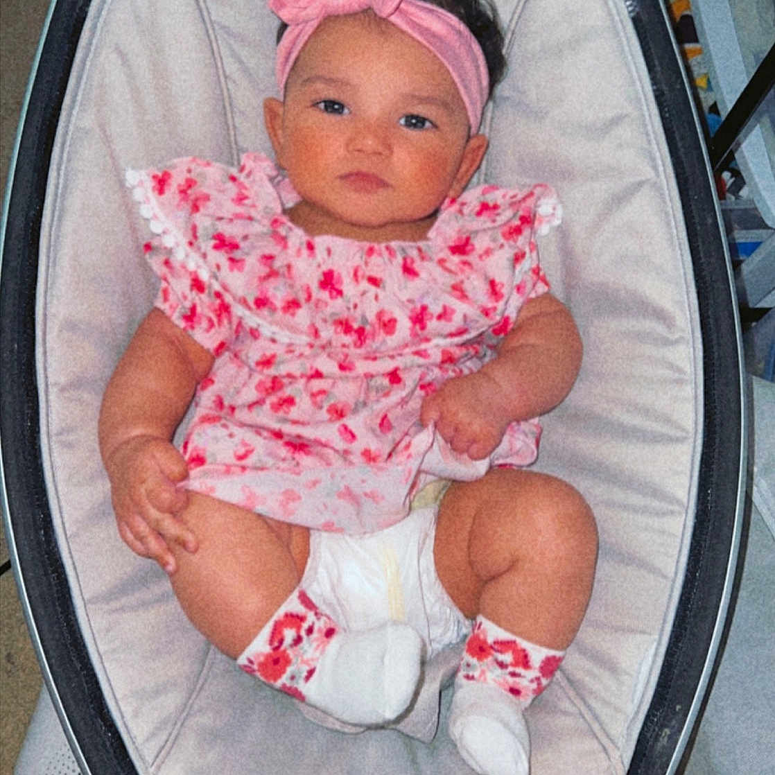 Kahlie joined the competition — help win amazing prizes! baby, baby_carriage, baby_products, baby_safety, baby_toddler_clothing, bag, car_seat, chair, cheek, child, circle, comfort, fashion_accessory, lap, pattern, pink, sitting, sleeve, sock, toddler