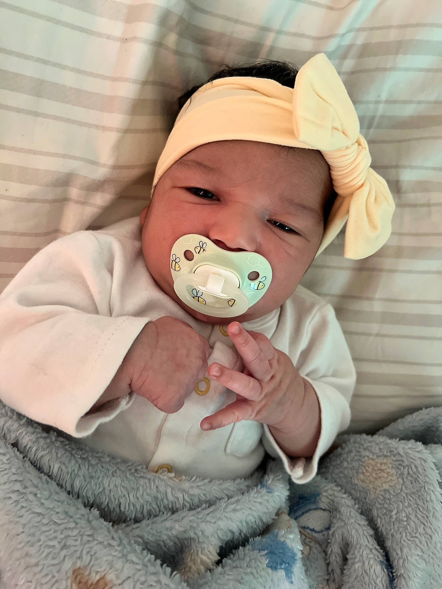 Kahlie is registered to the contest to win money with this photo: baby, baby_products, baby_safety, baby_sleeping, baby_toddler_clothing, cheek, child, comfort, eyelash, flesh, fur, happy, headwear, linens, neck, nose, outerwear, person, sitting, sleeve