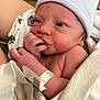 Maverick joined the competition — help win amazing prizes! newborn, baby, infant, hospital, blanket, hat, wristband, hand, face, skin, person, cute, small, newborn_baby, hospital_baby, wrapped, sleepy, expression, closeup, indoors