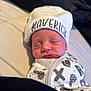 Maverick is registered to the contest to win money with this photo: baby, newborn, sleeping, hat, maverick, blanket, bed, swaddle, infant, face, peaceful, clothing, pattern, rest, cute, headwear, soft, indoors, person, portrait
