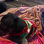 Luna Moon is registered to the contest to win money with this photo: animal, blanket, blurred, clothing, colorful, comfort, cozy, dog, fabric, floor, footwear, fur, home, indoor, laundry_basket, paw, person, pet, resting, sweater