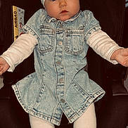 Savanna participe au concours pour gagner de l'argent avec cette photo : baby, infant, car_seat, denim_dress, headband, white_bow, white_tights, child, cute, portrait, indoors, person, clothing, sitting, small_child, face, young_child, fashion, casual_wear, expression
