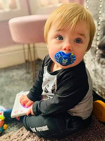 Riley joined the competition — help win amazing prizes! baby, baby_toddler_clothing, ball, cheek, child, comfort, electric_blue, flooring, fun, happy, leisure, people, person, play, portrait_photography, sitting, sleeve, sneakers, t_shirt, toddler