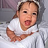Emily joined the competition — help win amazing prizes! baby, child, toddler, headband, pearl, flower, white_clothing, smiling, happy, towel, bed, indoor, person, cute, portrait, face, skin, hand, decor, star