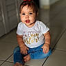 baby, barefoot, casual_clothing, child, curious, cute, face, floor, head, home, indoor, jeans, person, portrait, red_hair_accessory, sitting, tile, toddler, white_shirt, young_child