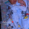 baby, sleeping, robe, blue, mickey_mouse, blanket, foot, hand, infant, cute, child, pattern, colorful, soft, clothing, portrait, indoors, cozy, time_stamp, overlay_text
