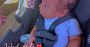 Akari joined the competition — help win amazing prizes! baby, car_seat, infant, pacifier, child, seatbelt, clothing, car_interior, safety, person, cute, young_child, indoors, seat, holding, looking, time_stamp, text_overlay, hand, foot