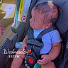 baby, car_seat, infant, pacifier, child, seatbelt, clothing, car_interior, safety, person, cute, young_child, indoors, seat, holding, looking, time_stamp, text_overlay, hand, foot